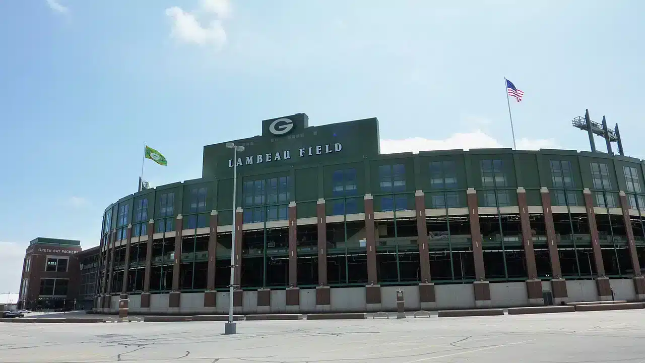Exterior of Lambeau Field, home of the Green Bay Packers, under a blue sky